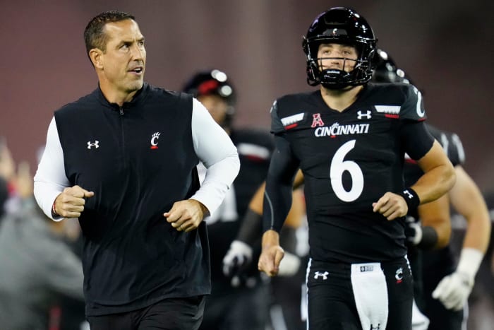 Cincinnati head coach Luke Fickell running out of the tunnel with the Bearcats.